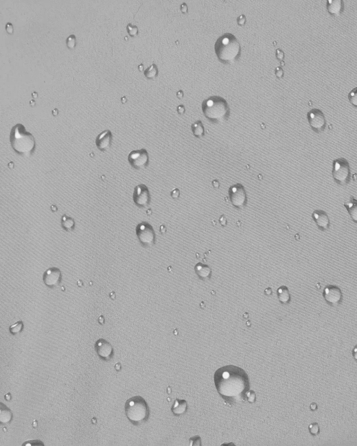 Wodoodporny materiał poncza samochodowego – krople wody na tkaninie